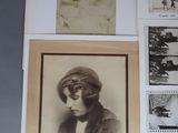 several framed photographs of women in hats and scarves on a wall
