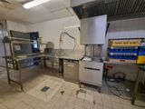 an image of a commercial kitchen with a lot of counter space