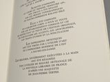 an open book with a poem on it sitting on a table
