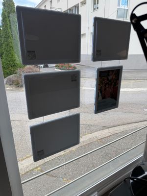 a view of a street through a window of a bus