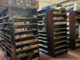 many shelves of bread in a store that is empty