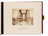an old photo of a book with a picture of a bridge on it