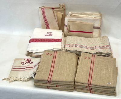 a lot of towels and napkins sitting on a table
