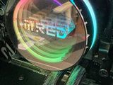 a close up of a computer motherboard with a colorful light on it