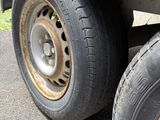 a flat tire on a flatbed trailer on the street