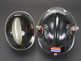 a black helmet with an orange and white stripe on it