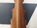 an image of a large wooden object in a corner of a room