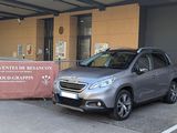 a car parked in front of a building with a sign on it