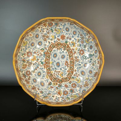 a plate with a floral design on it on a table