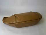 tan leather purse with a zippered closure