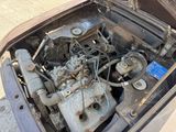 a car engine that is sitting in the trunk of a car
