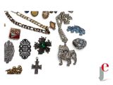 many different types of jewelry on a white surface