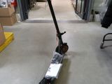 a scooter that is sitting in the middle of a room