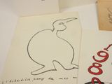 a drawing of a bird sitting on top of a piece of paper