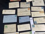 several old letters and envelopes on a table with a black background
