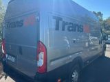 a silver van that is parked in the parking lot