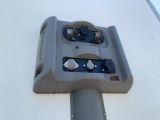 a close up of a parking meter on the side of a building