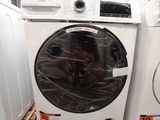 a washing machine and a dryer sitting on a pallet