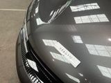 a close up of a car with a sticker on it ' s hood