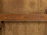 an image of a close up of a wooden frame with writing on it