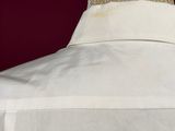 a close up of a white shirt on a mannequin dummy