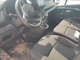 the interior of a car with a steering wheel and a dashboard