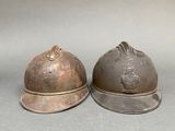 two helmets sitting next to each other on a table