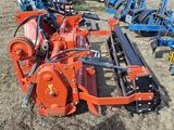 a tractor with a plow attached to it in a field