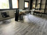 a room with a desk and a chair in it