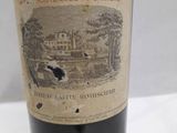 a bottle of wine that is sitting on a table