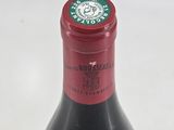 a bottle of wine that is sitting on a table