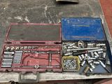 a tool box with tools on a table in a garage
