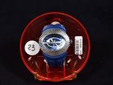 a blue and red watch sitting in a red case