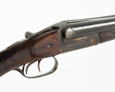 a close up of a rifle on a white background with a white background