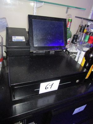 a laptop sitting on top of a black counter
