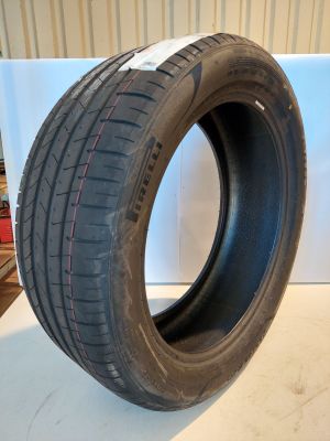 a close up of a tire on a white surface