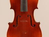 an old violin with a bow hanging from it ' s back