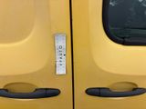 a sticker on the door handle of a yellow truck