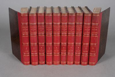 six red books lined up in a row on a gray surface