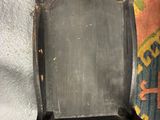an image of a chair that has been painted black