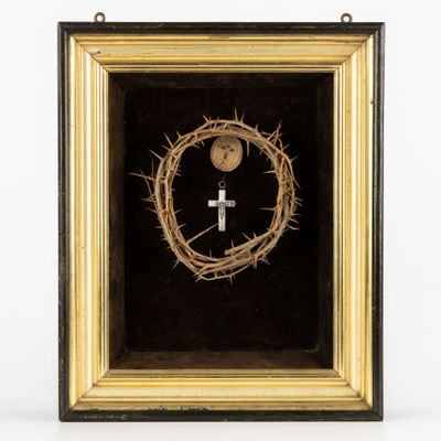 a close up of a cross and a crown of thorns in a frame