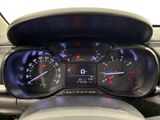 a close up of a car dashboard with a speedometer and gauges