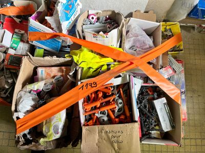 a pile of assorted items in a box on the floor