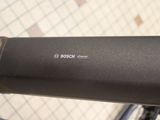 a close up of a bicycle handlebar with a logo on it