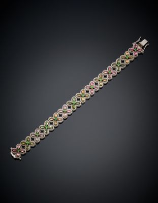 a bracelet with multicolored stones on a black background