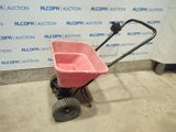 an image of a pink wagon with wheels in a garage