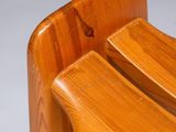 a close up of a wooden chair on a white background