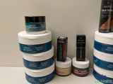 many different types of hair products displayed on a shelf