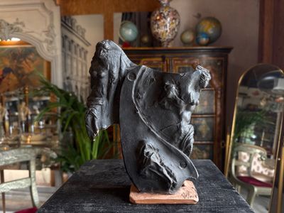 a statue of a horse on a table in a room