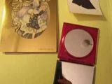 a box with a cd and a picture of a woman on it